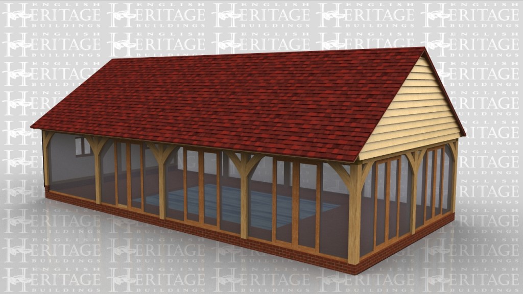 This 4 bay swimming pool enclosure has glass on three sides with five sets of glazed doors that would lead out onto a large paved patio area.