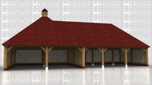 This building comprises of two frames. The first is a large square frame with hipped roof and a dovecote at the top. The second frame attached to it comprises of 3 open bays, 2 for cars and the other slightly smaller for garden machinery or motorbikes.