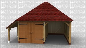 This two bay oak framed garage has one enclosed bay and one open bay. The enclosed bay is accessed via a set of garage doors to the front of the building. There is also an open logstore to the left of the building.