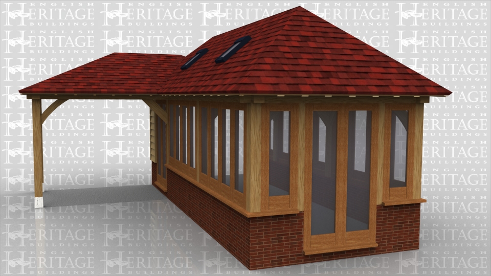 A fully glazed oak frame extension sitting on a dwarf brick wall with a covered walkway to the entrance doors. Four velux roof lights help to bring as much light into the building as possible while the barn hip roof end where the extension adjoins the house allows clearance to the existing house upstairs window.