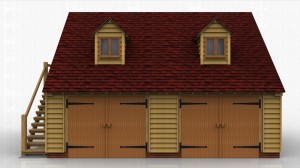 This two storey oak framed garage has two enclosed bays accessed via two sets of garage doors to the front of the building. The first floor is accessed by an external oak staircase to the left hand side and also by a half glazed door. There are two dormers to the front of the building and each dormer has a two pane window.