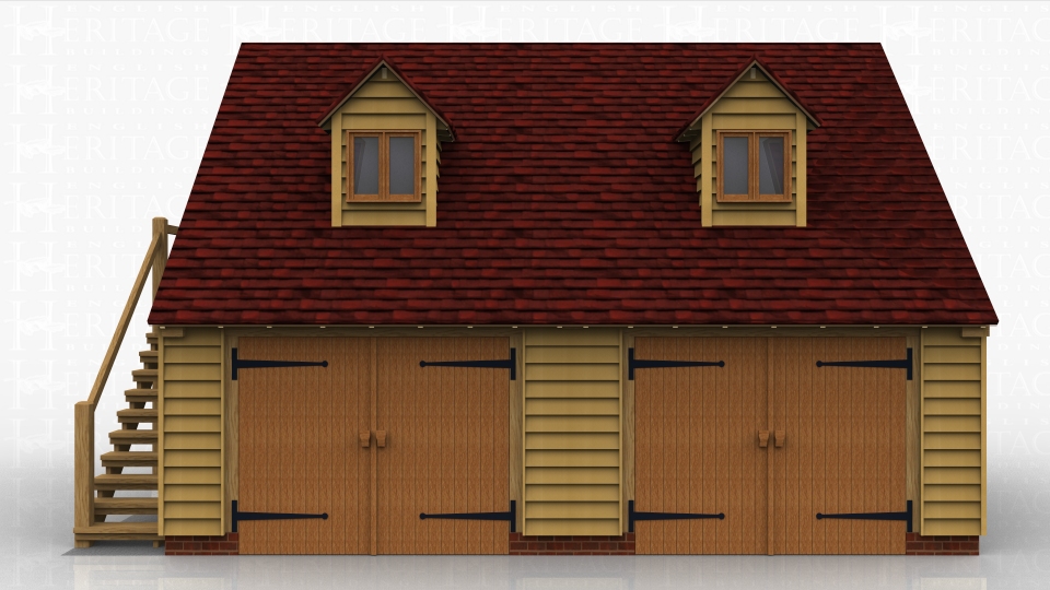 This two storey oak framed garage has two enclosed bays accessed via two sets of garage doors to the front of the building. The first floor is accessed by an external oak staircase to the left hand side and also by a half glazed door. There are two dormers to the front of the building and each dormer has a two pane window.
