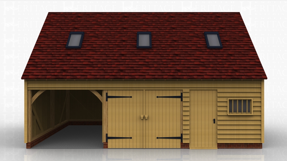 This oak framed garage has three bays; two are enclosed and one is open. The first enclosed bay has a set of garage doors to the front and the other enclosed bay has a single door and a mullion window, designed to be used as a store or a workshop. The first floor is accessed via a hatch in the store and has a three pane window to the left side as well as trimming for three rooflights.