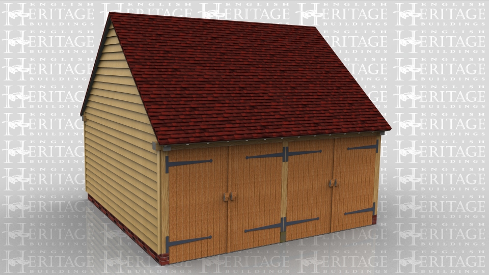 This oak framed garage has two enclosed bays, accessed by two sets of garage doors to the front.