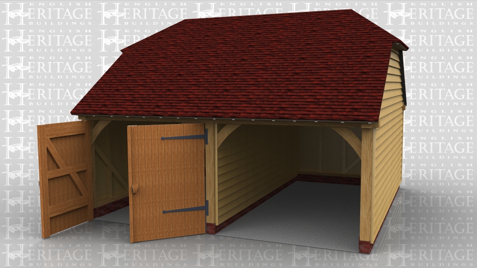 This oak framed two bay garage has one open bay and one enclosed bay. The enclosed bay is accessed via a set of garage doors to the front and a single half glazed door to the left hand side.