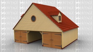 This two storey oak framed garage has three larger bays and one smaller bay. The three main bays are accessed by two sets of garage doors to the left hand side, with one bay open. The smaller bay is to the right and is accessed via a single half glazed door to the rear. The first floor is accessed via a hatch in one of the bays and the upstairs has two dormers, one to the front and one to the rear, with a two pane window. There is also a single circular window to the left hand side on the first floor.