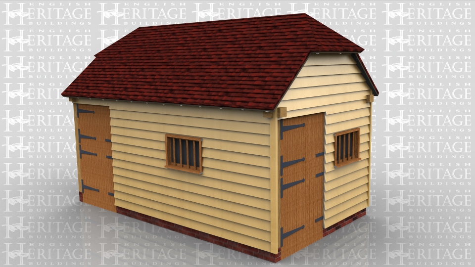 This oak framed stable has two bays, one small bay accessed by a stable door, and another large bay with a stable door to the right side, and a mullion window.