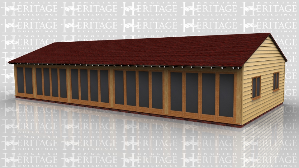 This oak framed home leisure building is formed of five bays. The front of the building is fully glazed with full length garden room windows, and the right side has two sets of two pane windows.