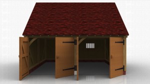 This oak framed garage has two bays, both enclosed. The bays are accessed by two sets of garage doors to the front of the building and the right hand bay has a mullion window to the rear.