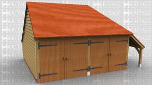 This oak framed garage is formed of two enclosed bays. The bays are accessed by two sets of garage doors to the front of the building and have an enclosed logstore to the rear. There is also an open store to the right hand side.