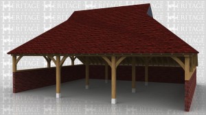 This oak framed garage sits on retaining walls on three side which are cut into a bank. The sides above the walls are left open so you just see the curved knee braces. The roof has a gablet at each end which is finished with lead sheet.