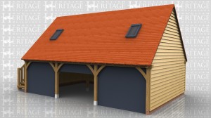 The customer has supplied and fitted 3 sets of their own sectional garage doors which fit behind the curved knee braces on this 3 bay oak frame garage. There is an oak external staircase on the left hand side that leads to a half glazed single door to access the first floor. The roof has gable ends and 2 Velux roof lights.