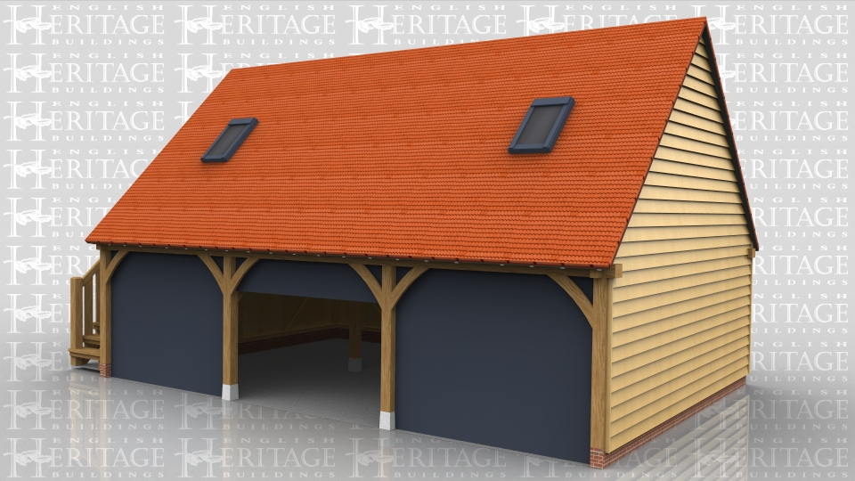 The customer has supplied and fitted 3 sets of their own sectional garage doors which fit behind the curved knee braces on this 3 bay oak frame garage. There is an oak external staircase on the left hand side that leads to a half glazed single door to access the first floor. The roof has gable ends and 2 Velux roof lights.