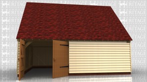 This building has one garage bay with garage doors on the front. The other bays are workshop / storage and a staircase to access the first floor. There is also a small one light casement window at each end.