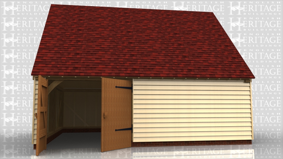 This building has one garage bay with garage doors on the front. The other bays are workshop / storage and a staircase to access the first floor. There is also a small one light casement window at each end.