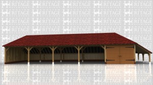 This building is a five bay garage block with four open bays and one enclosed by a partition and garage doors on the front. The roof has hipped ends and a logstore on the right hand side.