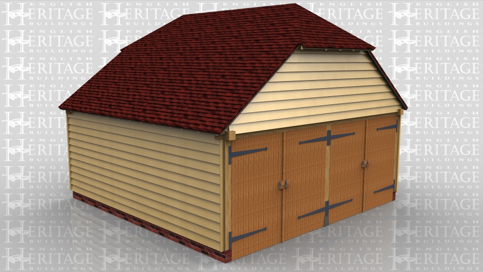 This building is a 2 bay garage secured with two pairs of traditional side hung garage doors. The roof has barn hip ends and 2 Velux rooflights.