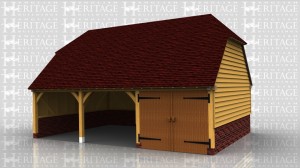 This oak framed garage is sitting on a high brick plinth because of the ground conditions. It has two open bays, with an enclosed bay secured with a partition and pair of garage doors. There is a first floor created with softwood floor joists on steel hangers and this is accessed via a hatch.