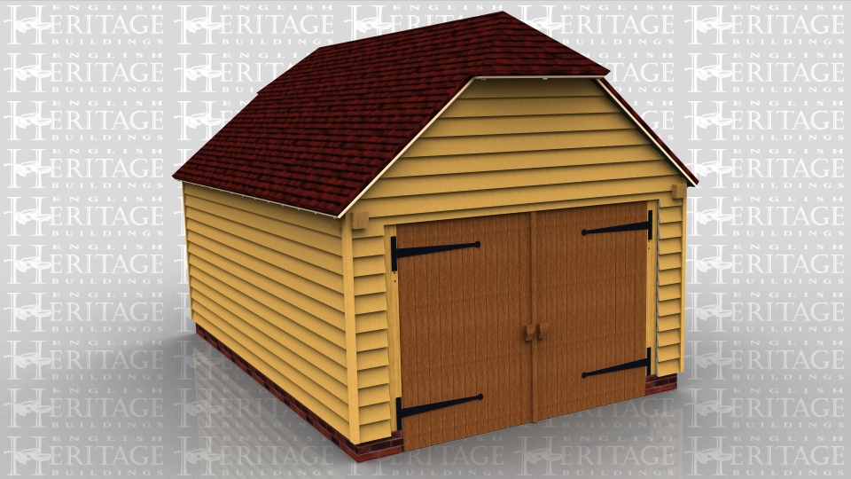 This oak frame garage is formed of two enclosed bays and there is a set of garage doors to the right side.