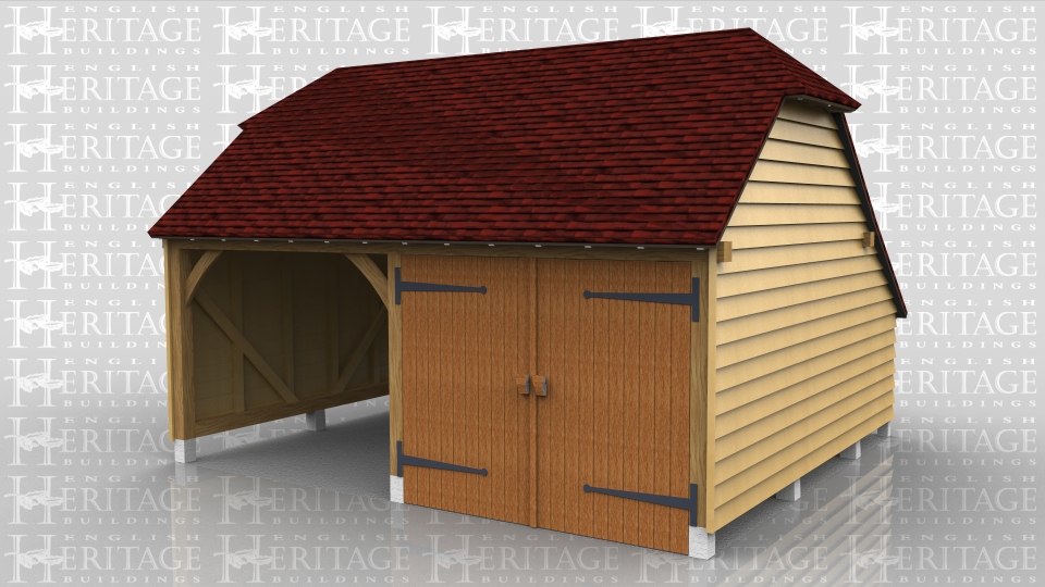 This oak frame is a two bay garage with rear catslide. There is no brick plinth so we installed all the posts on staddlestones. There is one pair of garage doors but the partition was being done by the customer.