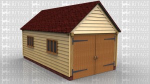 This building is a two bay oak framed garage secured with traditional side hung garage doors on the left side. The roof has gable ends and there are two three pane casement windows to the rear.