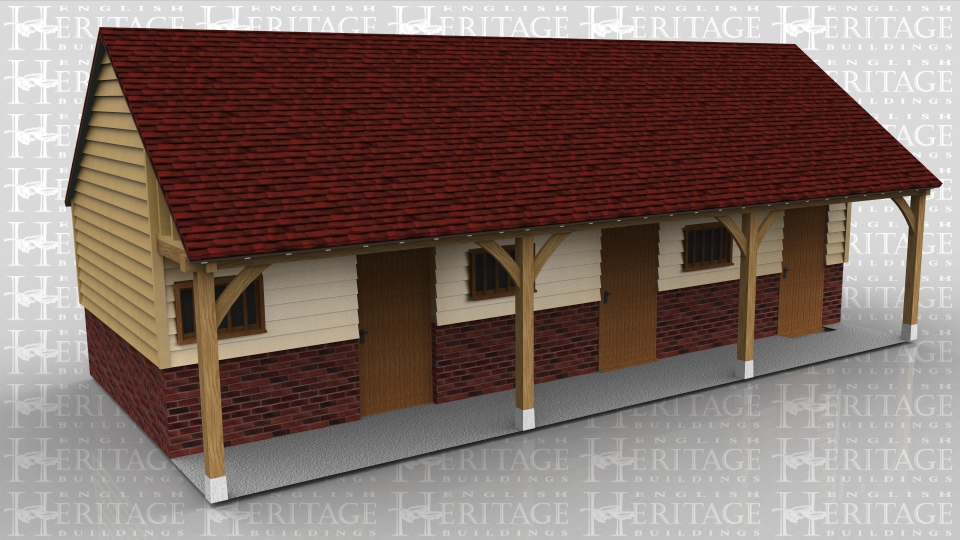 This three bay oak framed building has a set back front and is sitting on a high plinth wall. Each bay is seperated by partitions and has a decorative stable door and mullion window in the front. The centre bay also has a solid single door in the rear. Although this was made to look like a stable it is in fact three small workshop areas.