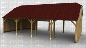 This oak frame is a large agricultural building for keeping tractors and other farm machinery in. It has a high 4m eaves height at the front and slightly lower at the rear because of the catslide roof.