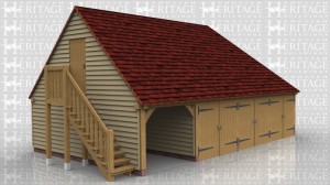 This oak framed garage with first floor has one open fronted parking space and three enclosed spaces that have garage doors on the front. There is an external oak staircase leading to a solid single door which accesses the first floor. The upstairs is one open space and there are three rooflights on the rear elevation, one of which is a means of escape.