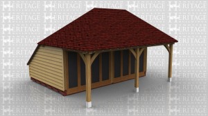 This oak frame is a small summerhouse/garden room. The front glazed units, which are both opening, are set back to create a covered sitting area. The roof  is hipped and has a catslide at the rear.