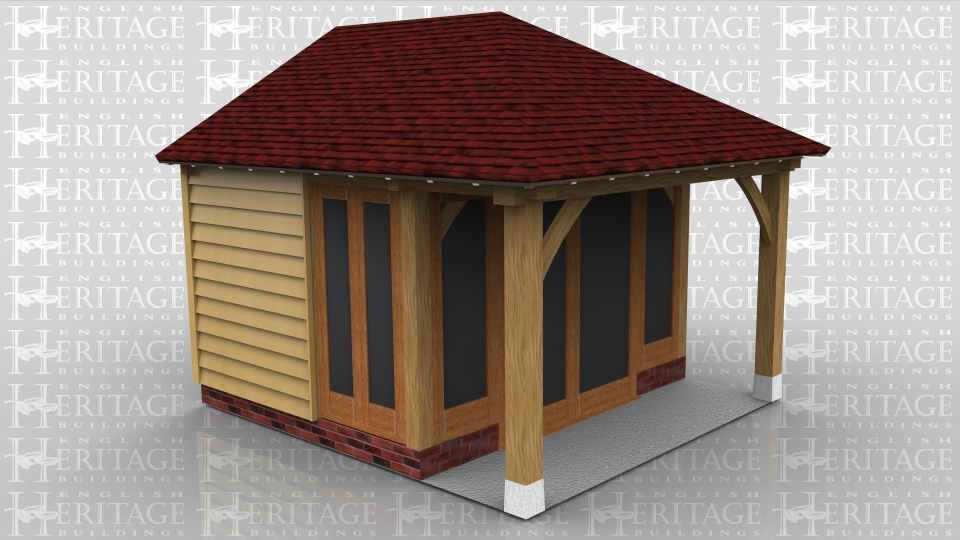 This oak frame is used as a small summerhouse / garden room. The fully glazed unit on the front is set back so there is a small veranda. Part of the side walls are glazed and the rest along with the rear are clad in weatherboard.