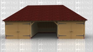 This three bay oak framed garage has hipped ends and an enclosed rear logstore. The bays are wider than normal to give that little bit of extra room as the outside two bays are enclosed with partitions annd garage doors leaving the centre bay open at the front.