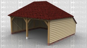 This two bay open fronted oak frame garage has hipped roof ends and an enclosed rear logstore to keep the ridge height below 4m and still give a usable internal depth.