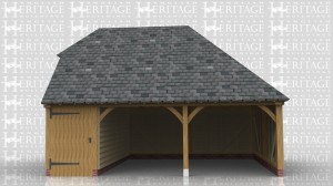 This oak framed building has two open fronted garage bays and a smaller bay enclosed with a partition and wide solid door at the front, to be used for storage. It has a barn hip on the left and a full hip on the right.