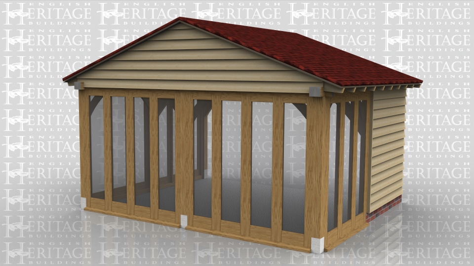 This oak framed garden room extension has a shallow pitched roof to avoid a first floor window. There is full bay glazing all around except one panel of weatherboard.