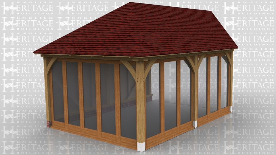 This oak framed home extension has one weatherboarded side and two sides with full length windows. The end of the frame is designed to be attached to an existing building.