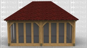 This oak framed garden room has full length windows along the front of the building and softwood boarding around the rest of the oak frame.