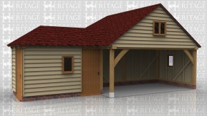 This oak framed garage complex has an enclosed storage room or workshop, a two bay open garage, and an enclosed single bay garage to the rear. The store room is accessed by two solid single doors and it has a single pane window to the front.