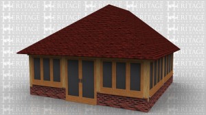 This oak framed three bay oak framed garden room extension to a house is sitting on a dwarf cavity brick wall apart from the fully glazed doors. Full glazing on all three sides.