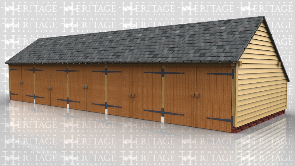 This oak framed five bay garage has five sets of garage doors and an enclosed log store to the side. The building also has an enclosed store to the rear.