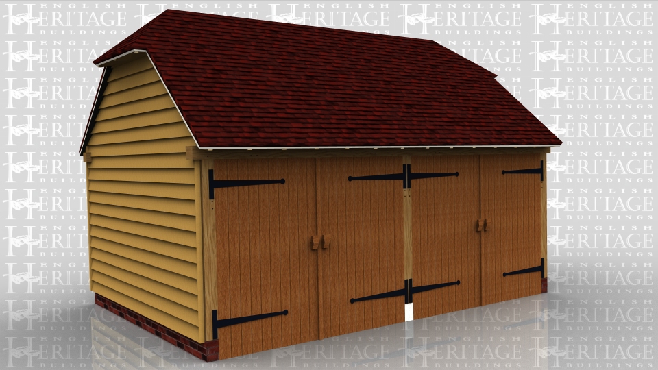 This oak framed building is a two bay garage secure with garage doors and a barn hip at each end.