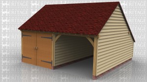 This is a two bay oak framed garage with on enclosed bay secured with a set of garage doors. There is also an enclosed store to the rear.