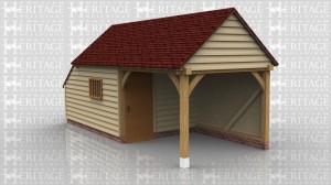 This is an oak framed building one of the bays is enclosed and can be accessed via the single door in the partition. There is also a mullion window at the front of the building. To the left of the building is an enclosed store.