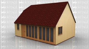 This is a three bay oak framed building with a steep enough pitch to give an upper floor area if needed. At the front there are two sets of four pane full height glazed units which open out as doors. There is a single door and a single pane window. There is also a single door on the left hand side and a two pane window on the right hand side. There is one rooflight at the front of the building and a barn hip on the left hand side.