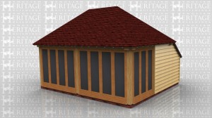 This is an oak framed building. At the front there are two sets of glazed french doors. There is also a set of french doors on the left hand side and there is a three pane unit on the right hand side.