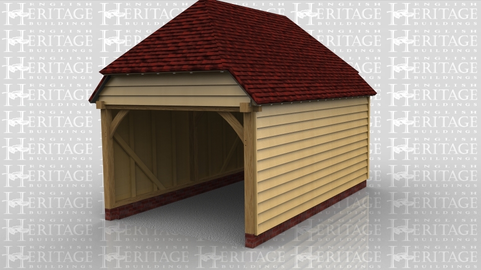 This oak framed building is a one bay garage with an open front and the rest enclosed.