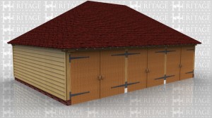 This oak framed garage building has three enclosed garage bays, each accessed by a standard garage door to the front of the building.