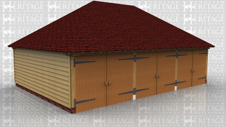 This oak framed garage building has three enclosed garage bays, each accessed by a standard garage door to the front of the building.