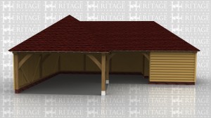 An L shaped oak framed garage. One end has a bay for parking whilst the other has a studio or storage space connected.