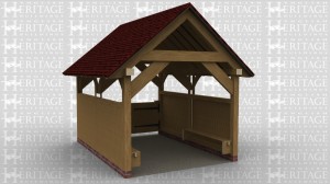 A 2 bay Oak framed boat house open at one end and at the other is a pair of doors