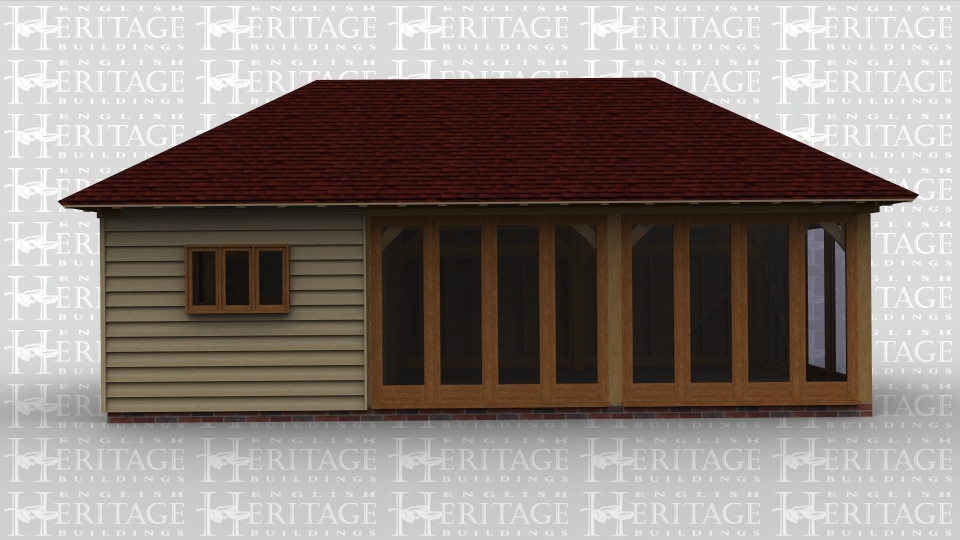 An oak garden room / summer house with some full height glazing and a workshop to one side.